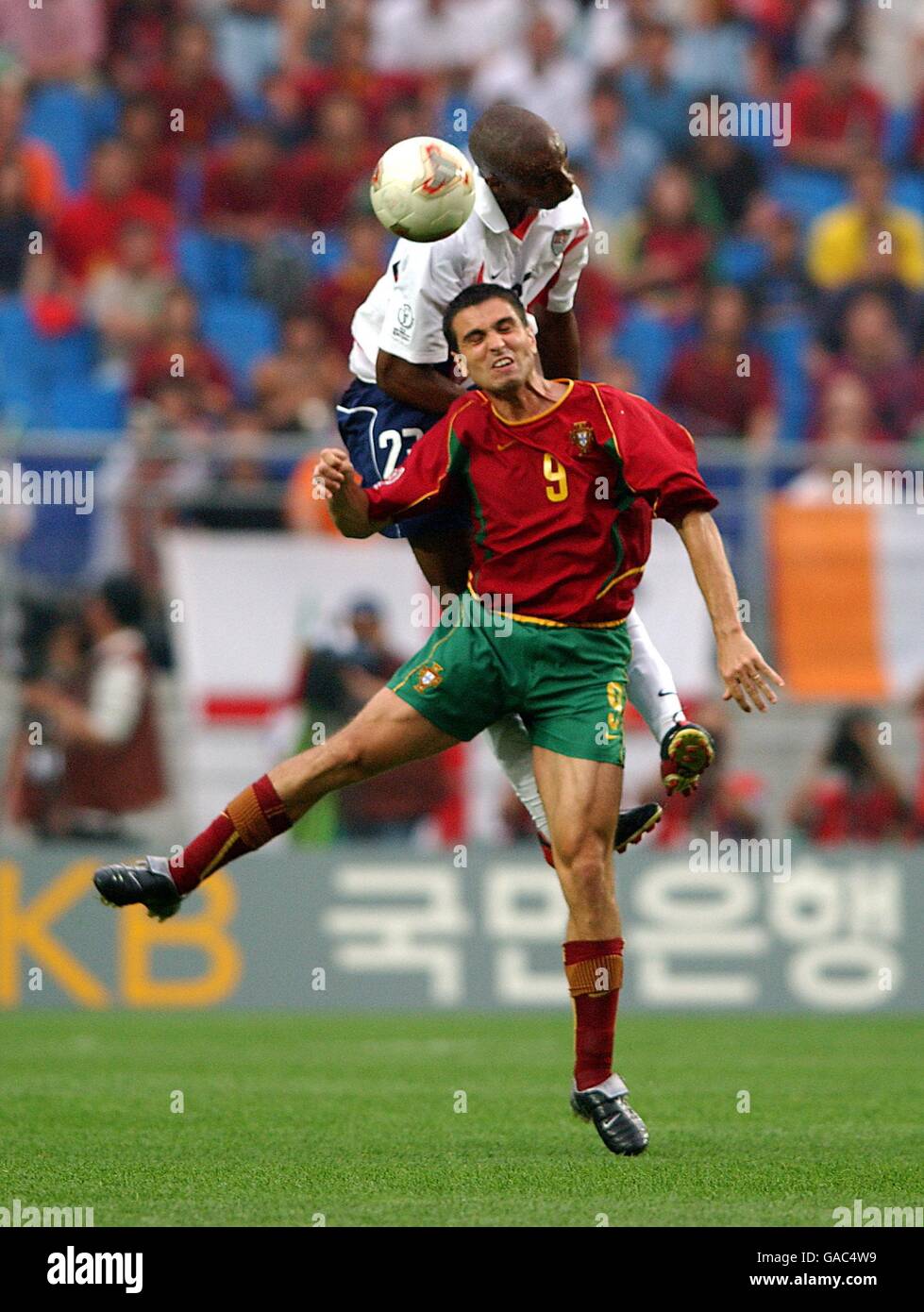 USA's Eddie Pope wins the ball from Portugal's Pauleta Stock Photo