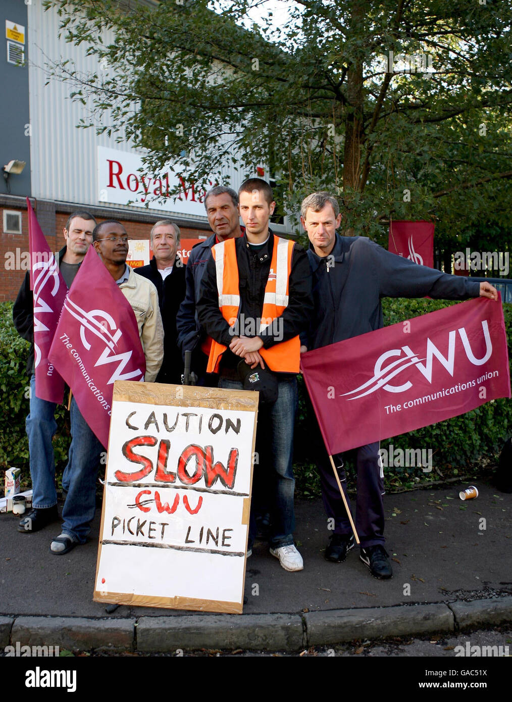 Royal Mail staff strike outside the sorting office on Station Road, in