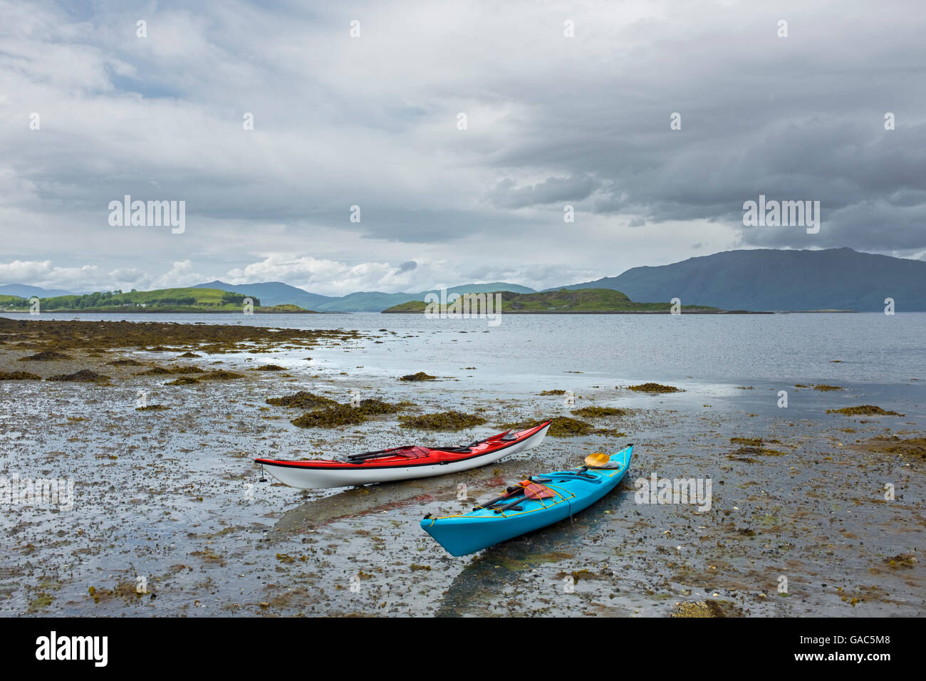 Sea kayaks on the shores of Loch Linnhe, Scotland. Stock Photo