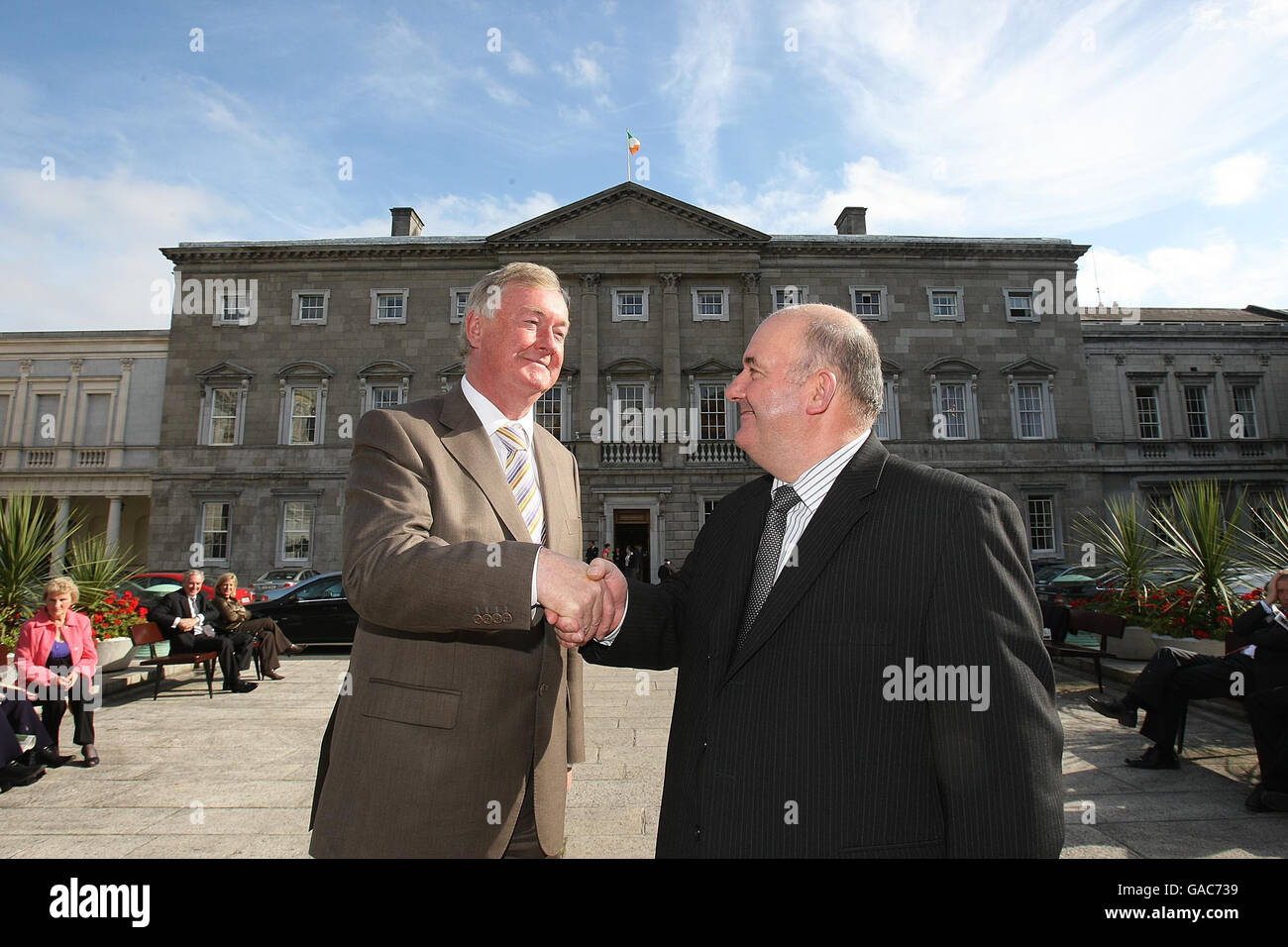 Speaker of the Northern Ireland Assembly William Hay (right) stands