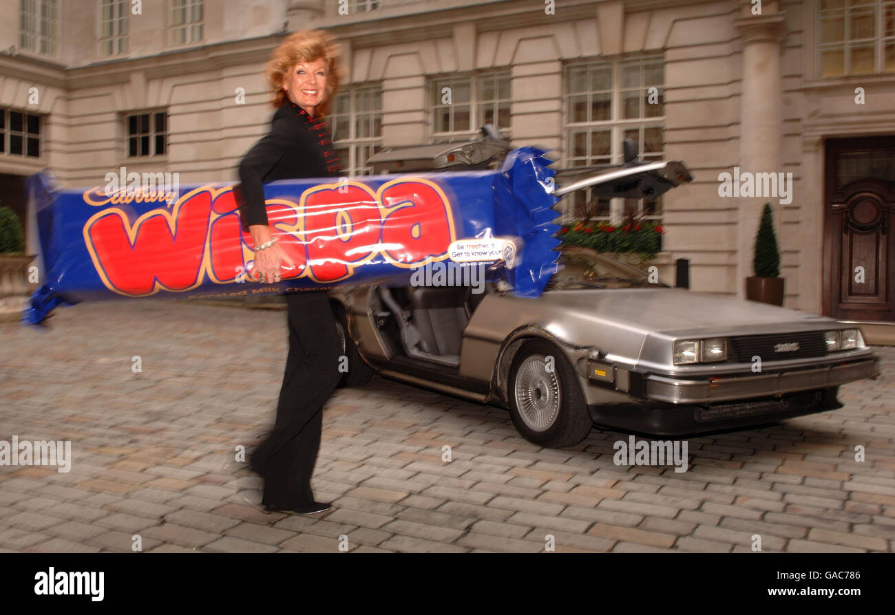 Rula Lenska relaunches the Wispa Chocolate bar with the help of the Back to the Future DeLorean car, at Chancery Court Hotel in central London. Rula starred in the original Wispa adverts with Dennis Waterman. Stock Photo