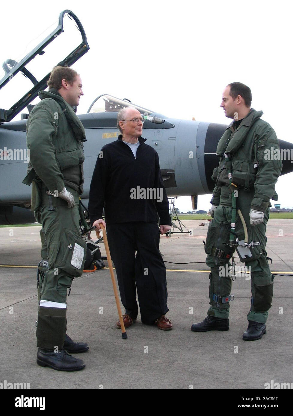 John Russell, 65, (centre) meets Flight Lieutenant Mark Haley (right) and Squadron Leader Roger Organ (left), the two tornado pilots who rescued him from a glider crash in Scotland last July. Stock Photo