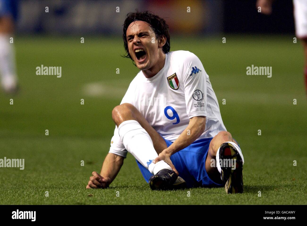 Italy's Filippo Inzaghi feels his calf after a late challenge Stock Photo