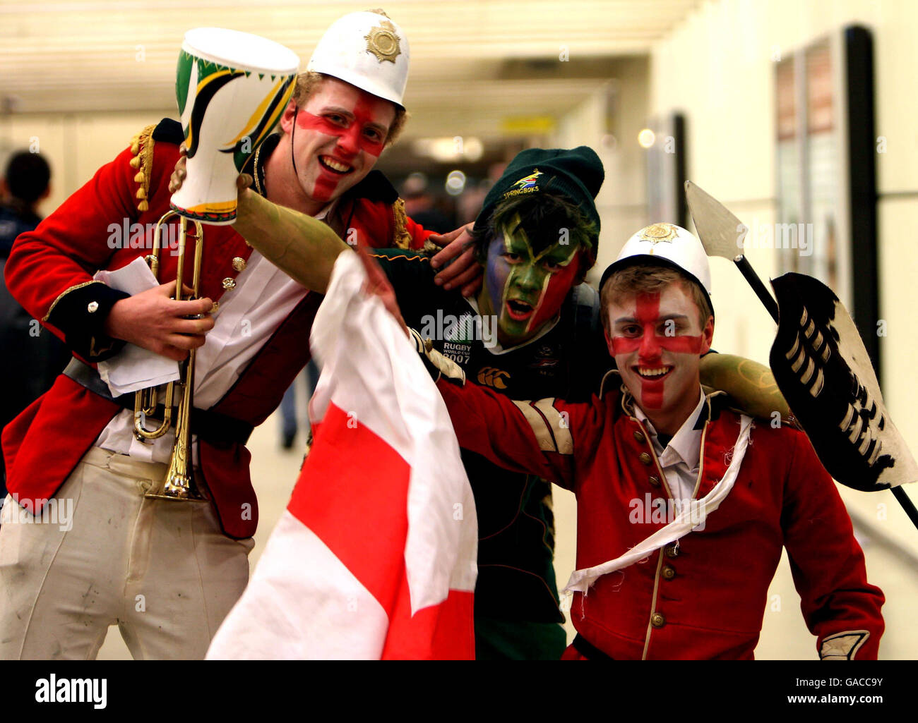 England fans (left to right) George Bone, Oliver Aiken and Jamie Graves from Oxford arrive at the Gare du Nord Rail Station in Paris ahead of England's Rugby World Cup Final Match at the Stade De France tomorrow. Stock Photo