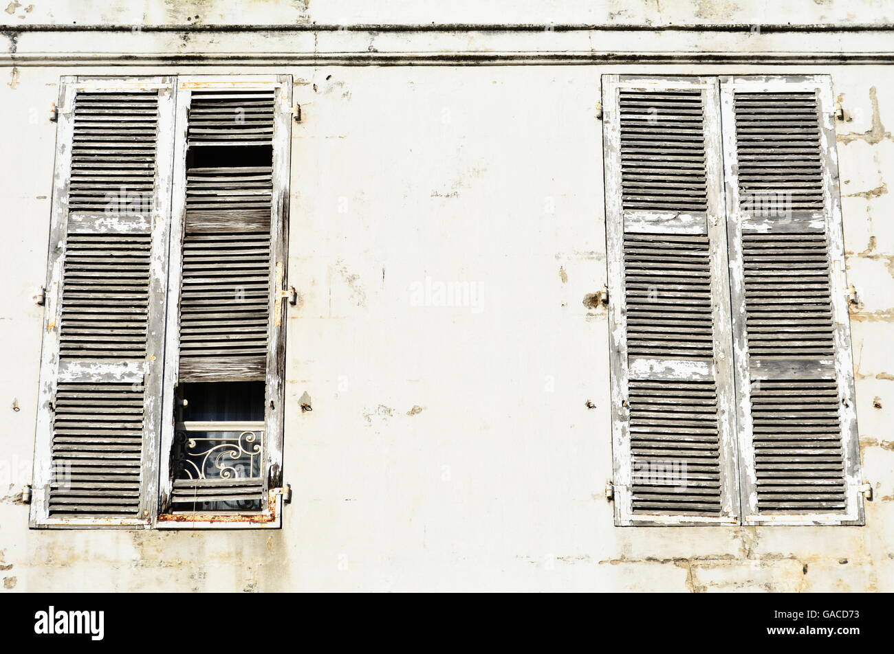Large white weathered closed window wooden shutters Stock Photo - Alamy