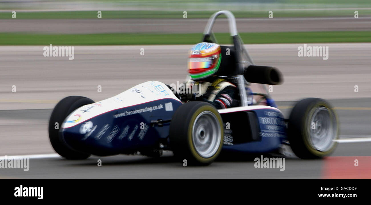 Student Nelson Mason, from Oxford Brookes University, drives a Formula Student Race car at the launch of the Institution of Mechanical Engineers' competition to find the world's greenest eco-race car at the Silverstone Race Circuit, Northamptonshire. Stock Photo