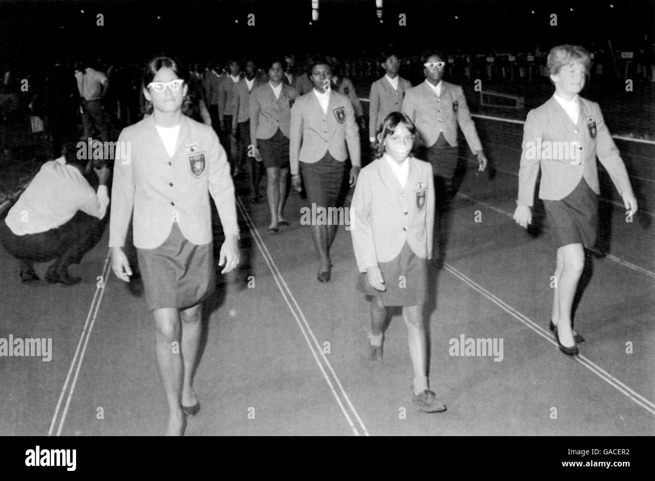 The Games' youngest competitor, ten year old diver Betty Sullivan, parades around the National Stadium with her Jamaica teammates Stock Photo