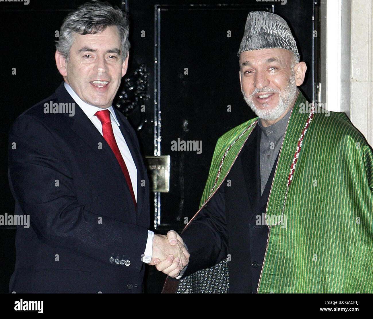 Prime Minister Gordon Brown greets Afghan President Hamid Karzai on the steps of 10 Downing Street, London. Stock Photo