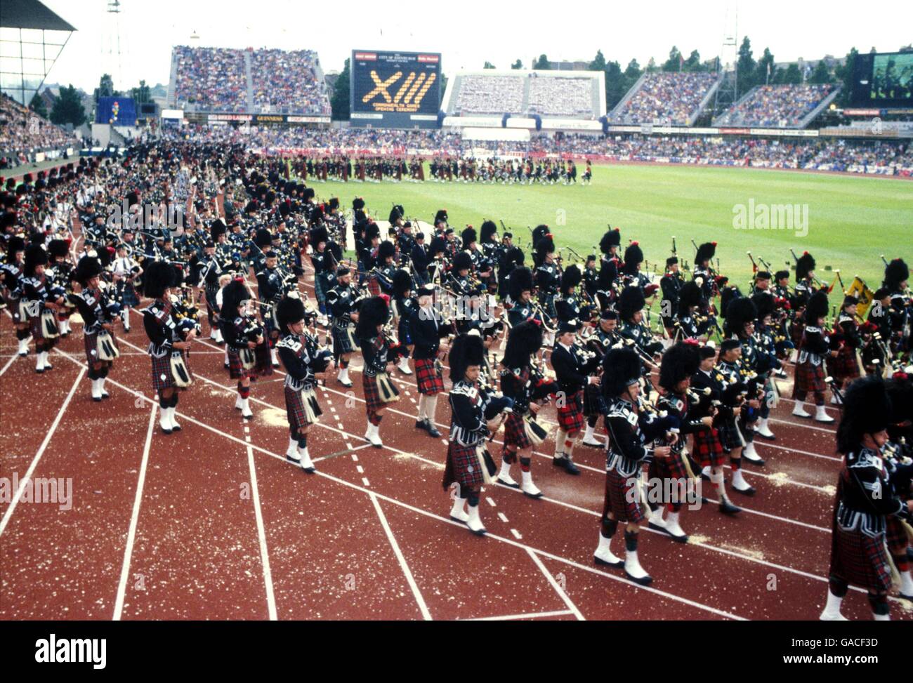 13th Commonwealth Games - Edinburgh - Opening Ceremony. A huge cordon of pipers march around Meadowbank Stadium during the Opening Ceremony Stock Photo