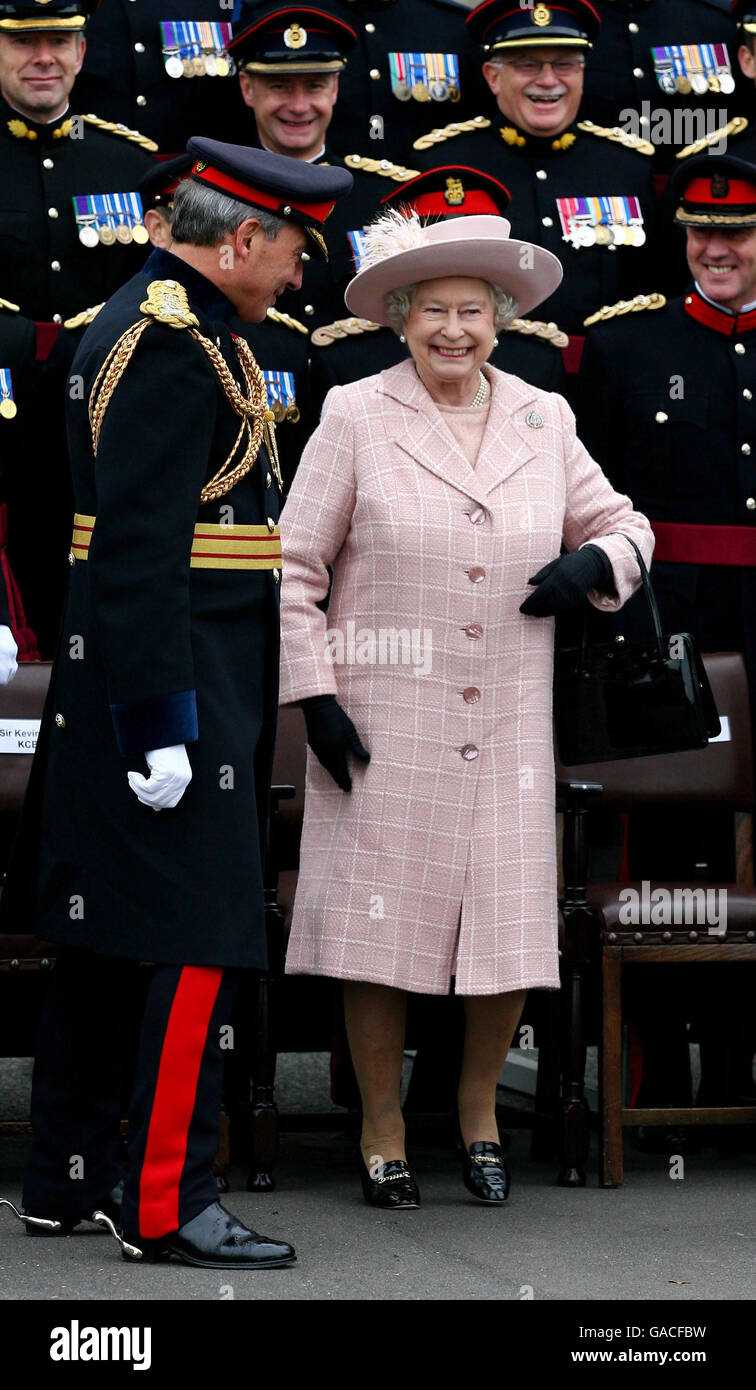 Britain's Queen Elizabeth II accompanied by Chief Royal Engineer Sir Kevin O'Donoghue (left) after posing for a photograph during a visit to the Corps of Royal Engineers at Brompton Barracks, Chatham, Kent. Stock Photo
