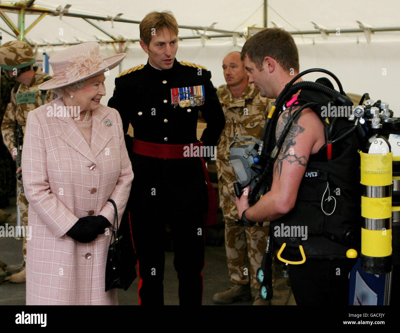 Britain's Queen Elizabeth II meets Sgt. Pete Donnelly during a visit to the Corps of Royal Engineers at Brompton Barracks, Chatham, Kent. Stock Photo