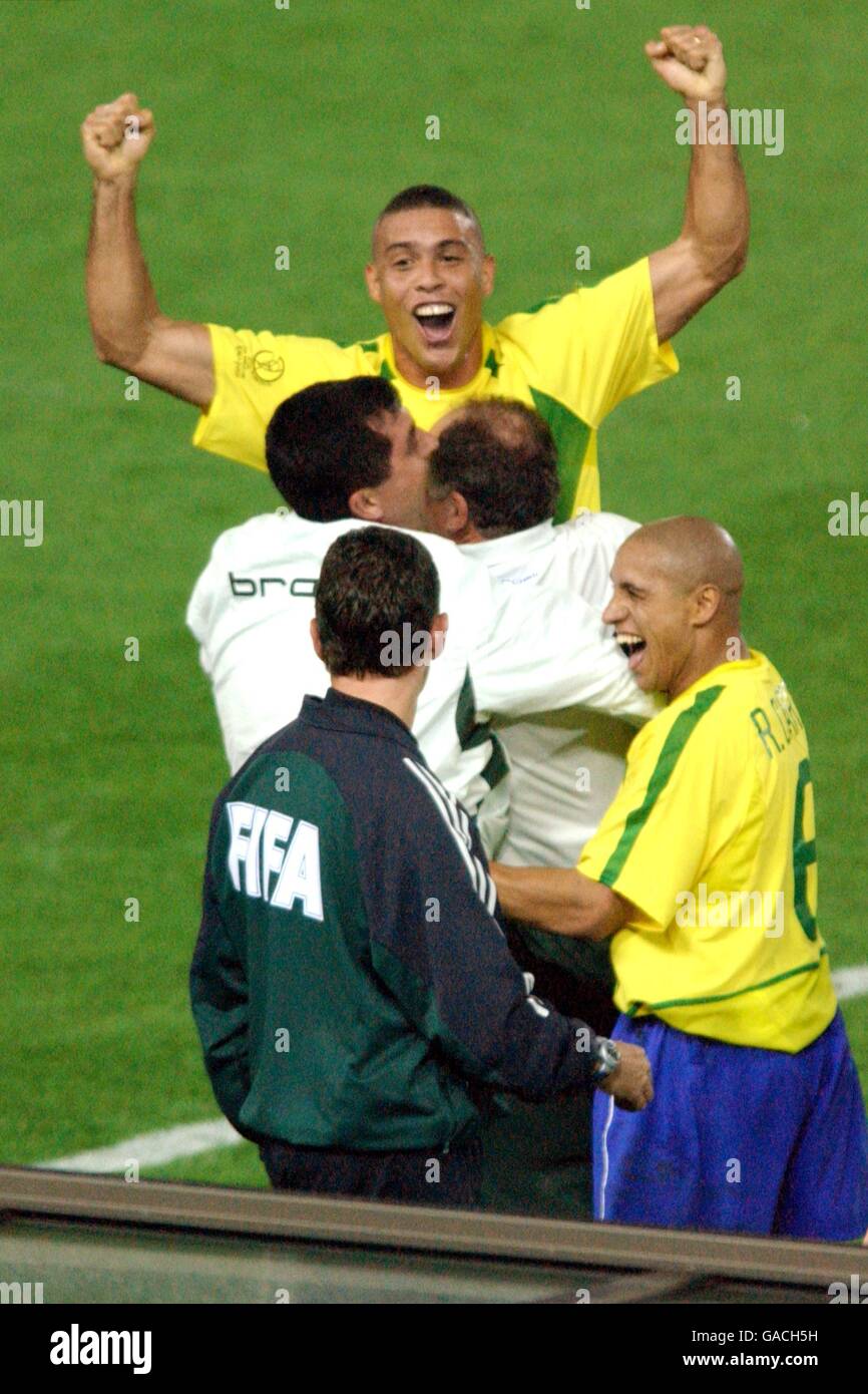 Brazil's two goal hero Ronaldo celebrates scoring their second goal with Coach Luiz Felipe Scolari (right) and Roberto Carlos Stock Photo