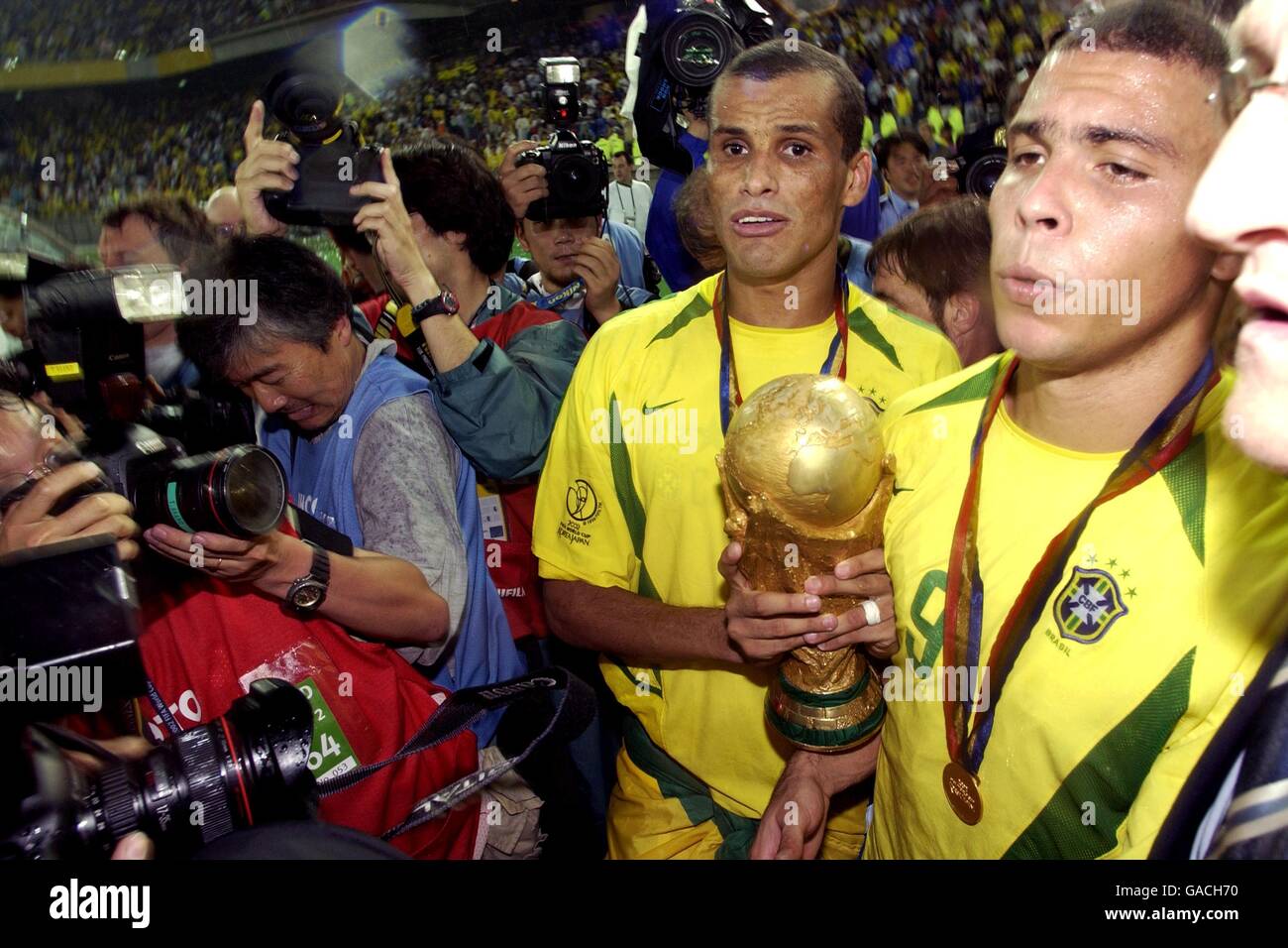 Ronaldo Nazario looks at his 2002 FIFA World Cup winners trophy
