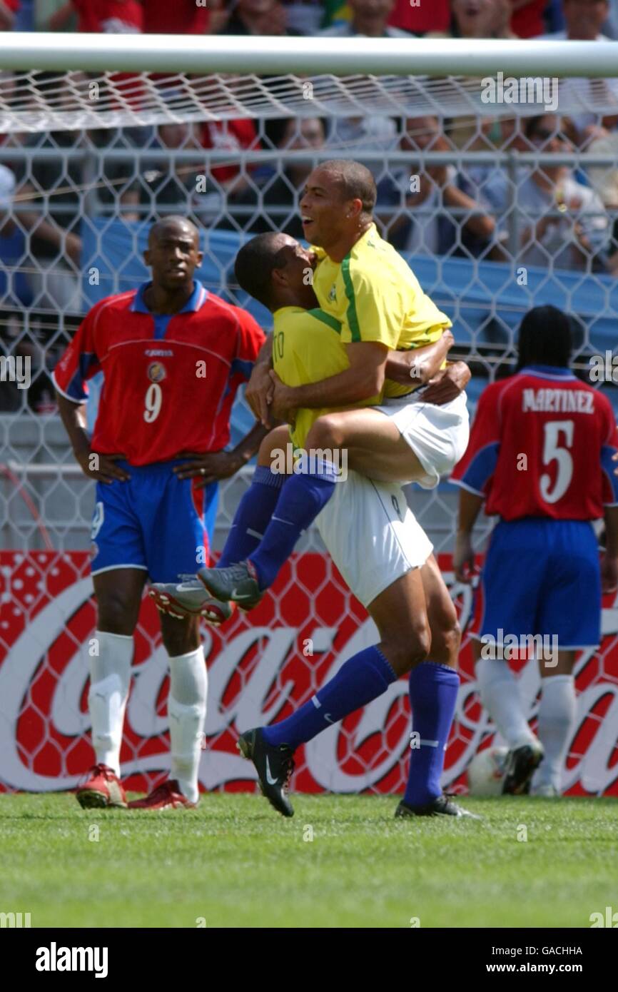 Soccer - FIFA World Cup 2002 - Group C - Costa Rica v Brazil. Brazil's Ronaldo celebrates with Gilberto Silva after scoring Brazil's second goal against Costa Rica Stock Photo