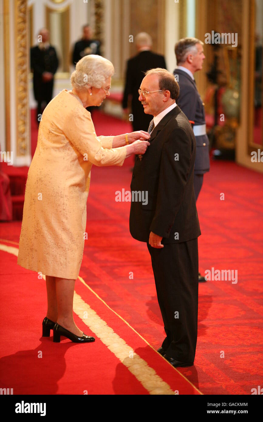 Mr. Atholl Swanston, Station Supervisor, Alnmouth Railway Station, Northumberland, from Amble, receives an MBE from The Queen at Buckingham Palace, for services to Transport. Stock Photo
