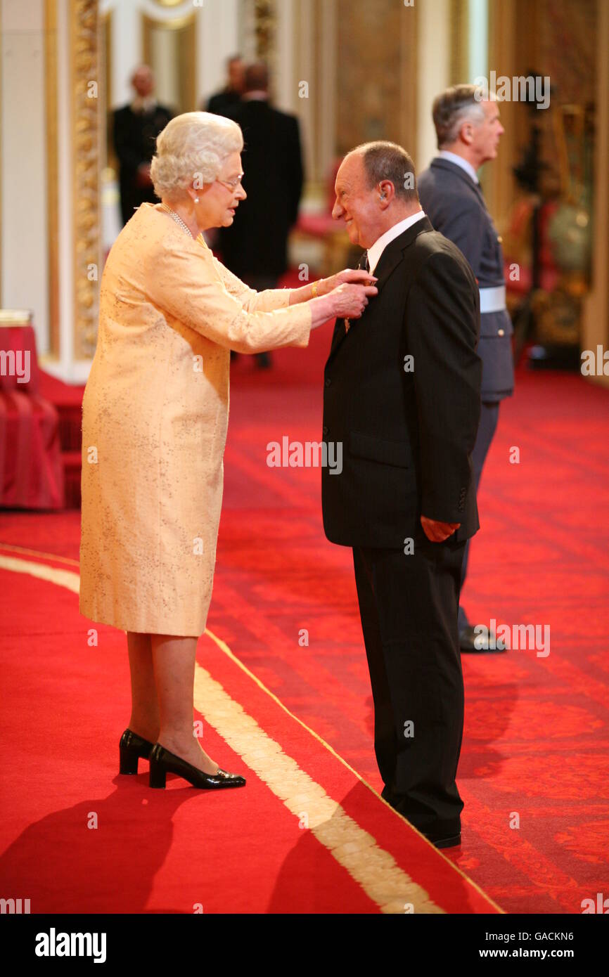 Mr. David Gillert, from Worksop, receives an MBE from The Queen at Buckingham Palace, for services to the Sea Cadet Corps in Worksop, Nottinghamshire. Stock Photo