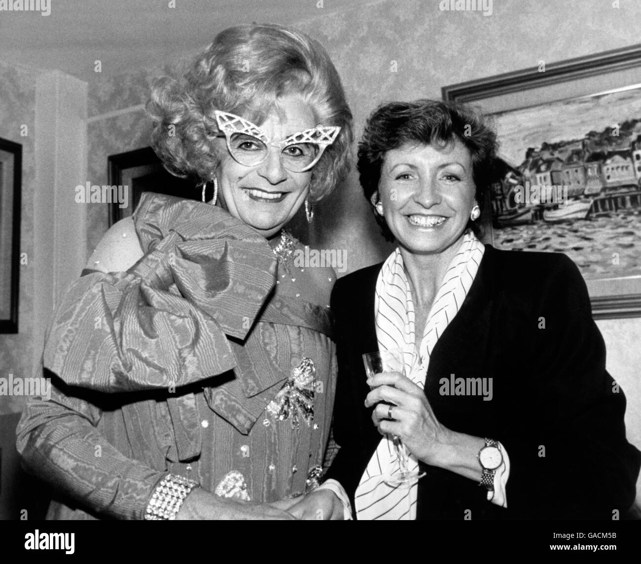 Melbourne housewife Dame Edna Everage, alias comedian Barry Humphries, is put on the spot by broadcaster Sue Lawley, when she interviewed the Australian for Desert Island Discs programme on BBC Radio Four. Stock Photo
