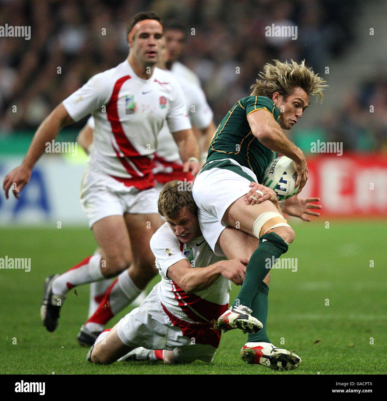 England's Mark Cueto tackles South Africa's Percy Montgomery during the IRB Rugby World Cup Final match at Stade de France, Saint Denis, France. Stock Photo