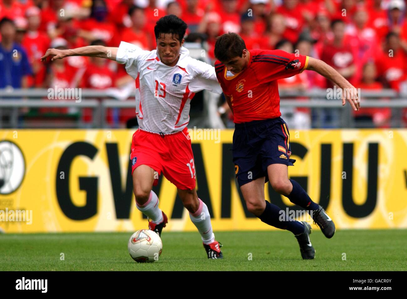 Soccer -Fifa World Cup 2002 - Quarter Final - Spain v Republic of Korea. Spain's Joaquin battles with Republic of Korea's Eul Yong Lee Stock Photo