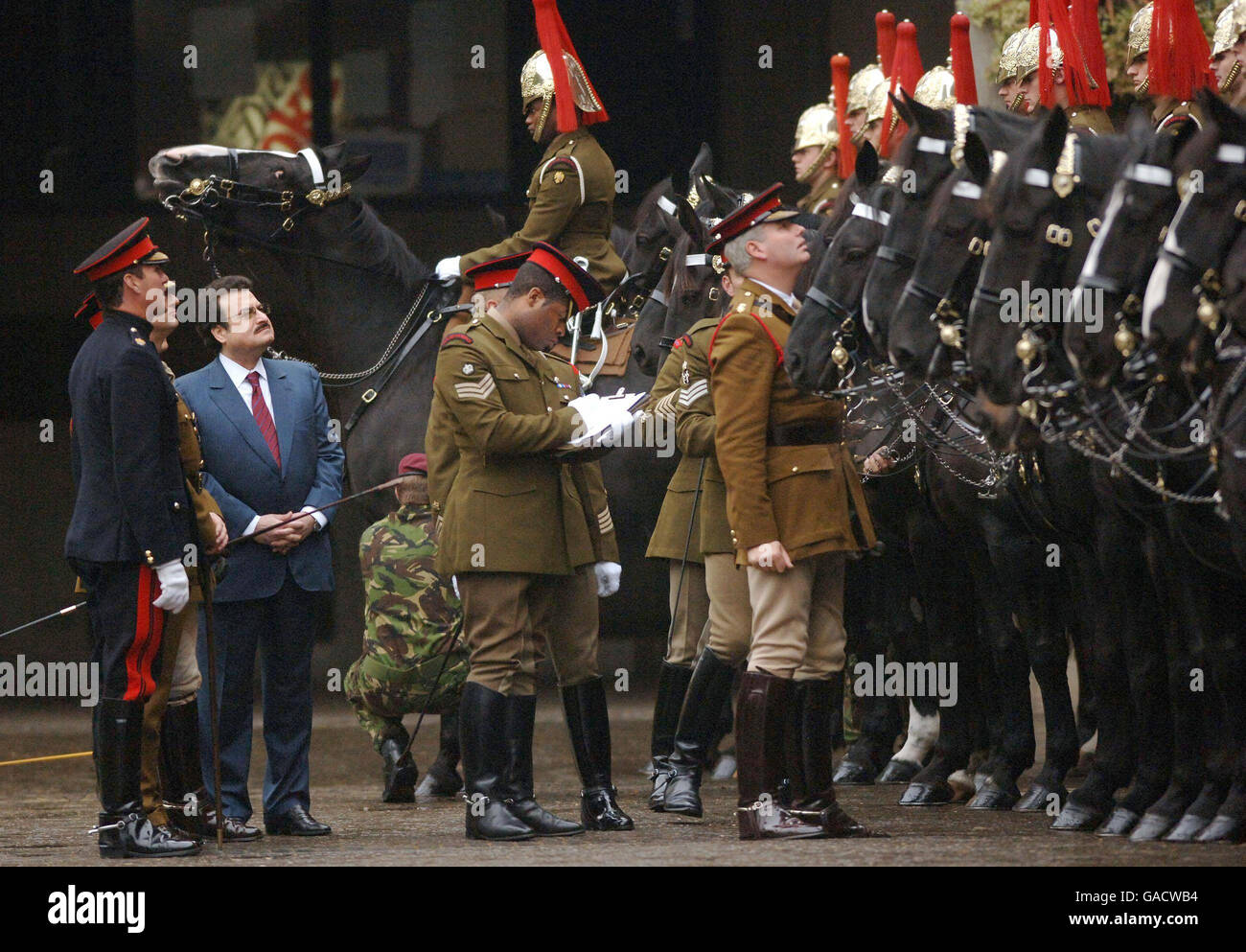 Lt Col Ralph Griffin LG Commanding Officer (right) joins Prince Mohammed bin Nawaf bin Abdul Aziz Al-Saud, the Saudi Arabian Ambassador to the UK, during a visit to the Household Cavalry Mounted Regiment ahead of the King of Saudi Arabia's state visit next week, at Hyde Park Barracks, London. Stock Photo