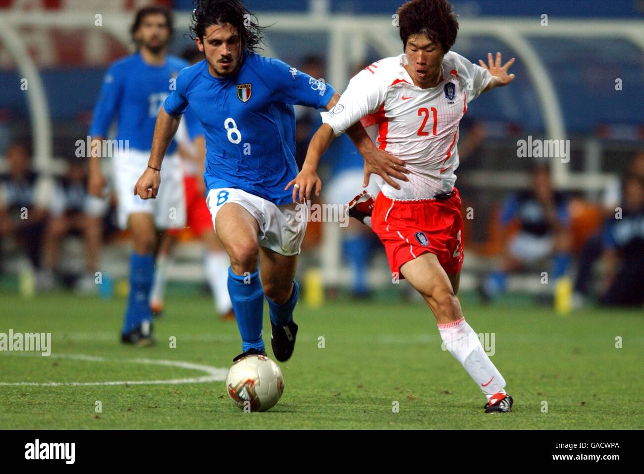 (L-R) Italy's Gennaro Guttuso Korea's Sung Ji Park battle for the ball. Stock Photo