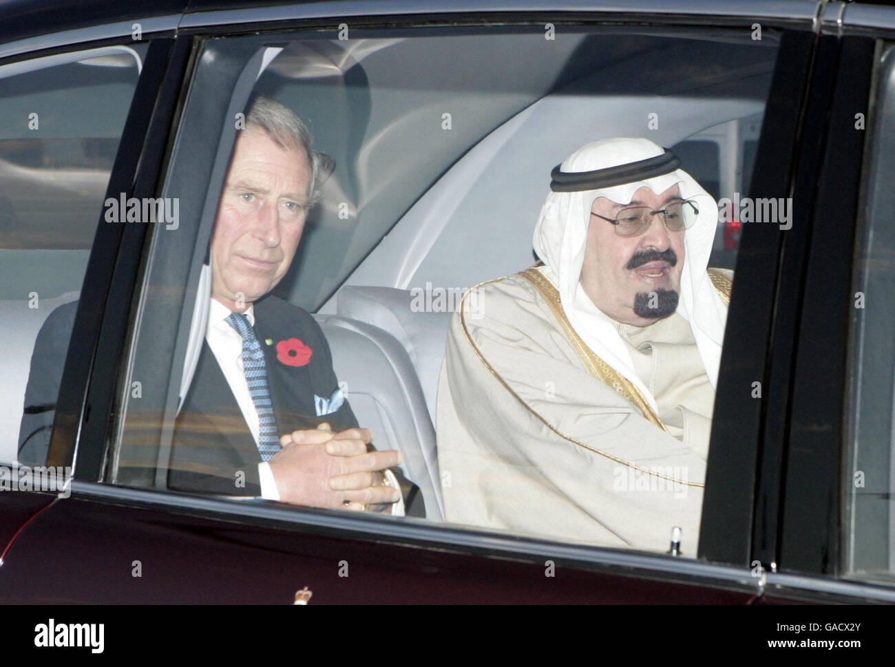 King Abdullah of Saudi Arabia (right) and The Prince of Wales drive from Heathrow airport after the arrival of the King for a state visit. Stock Photo