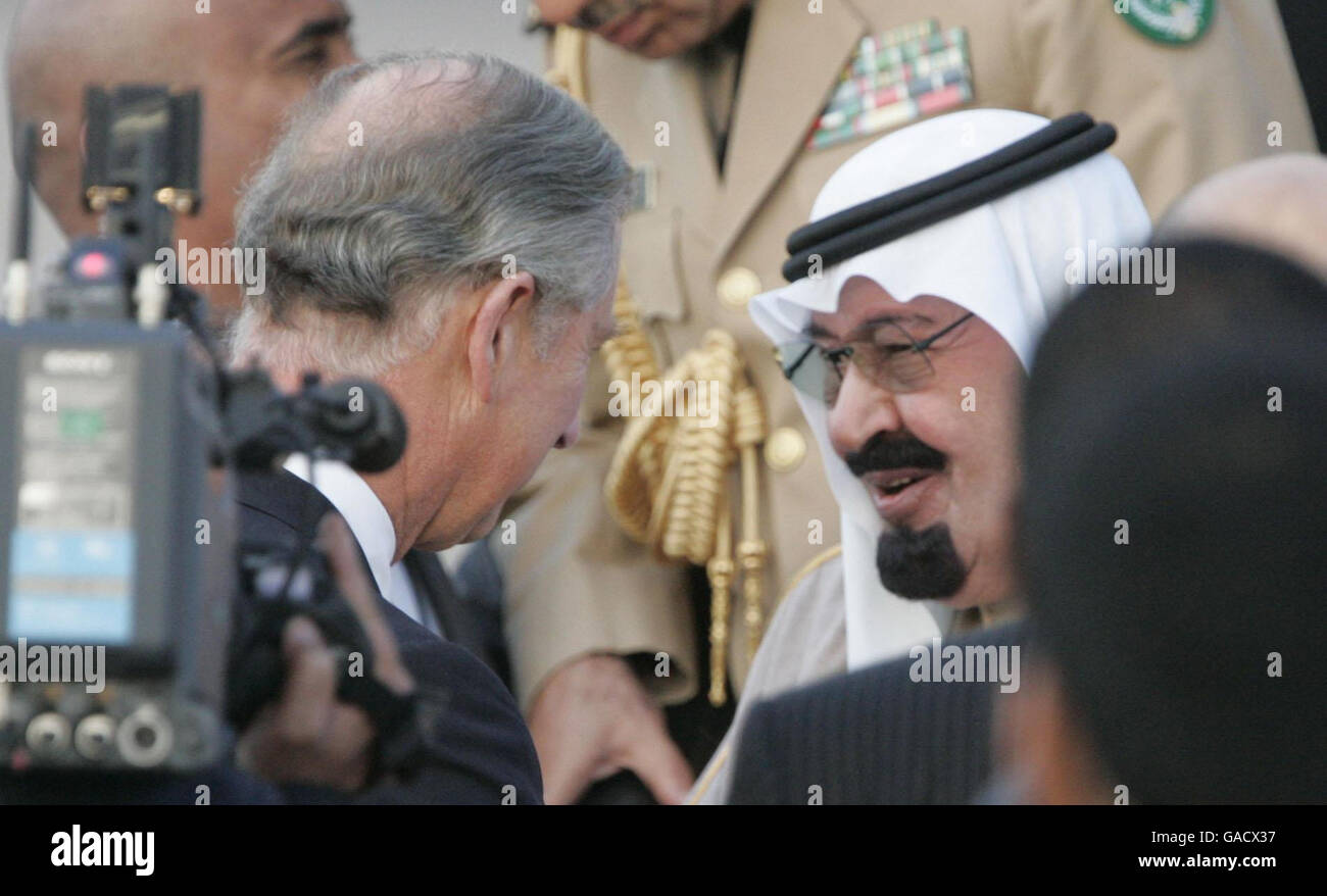 King Abdullah of Saudi Arabia (right) is greeted by The Prince of Wales at Heathrow airport. Stock Photo