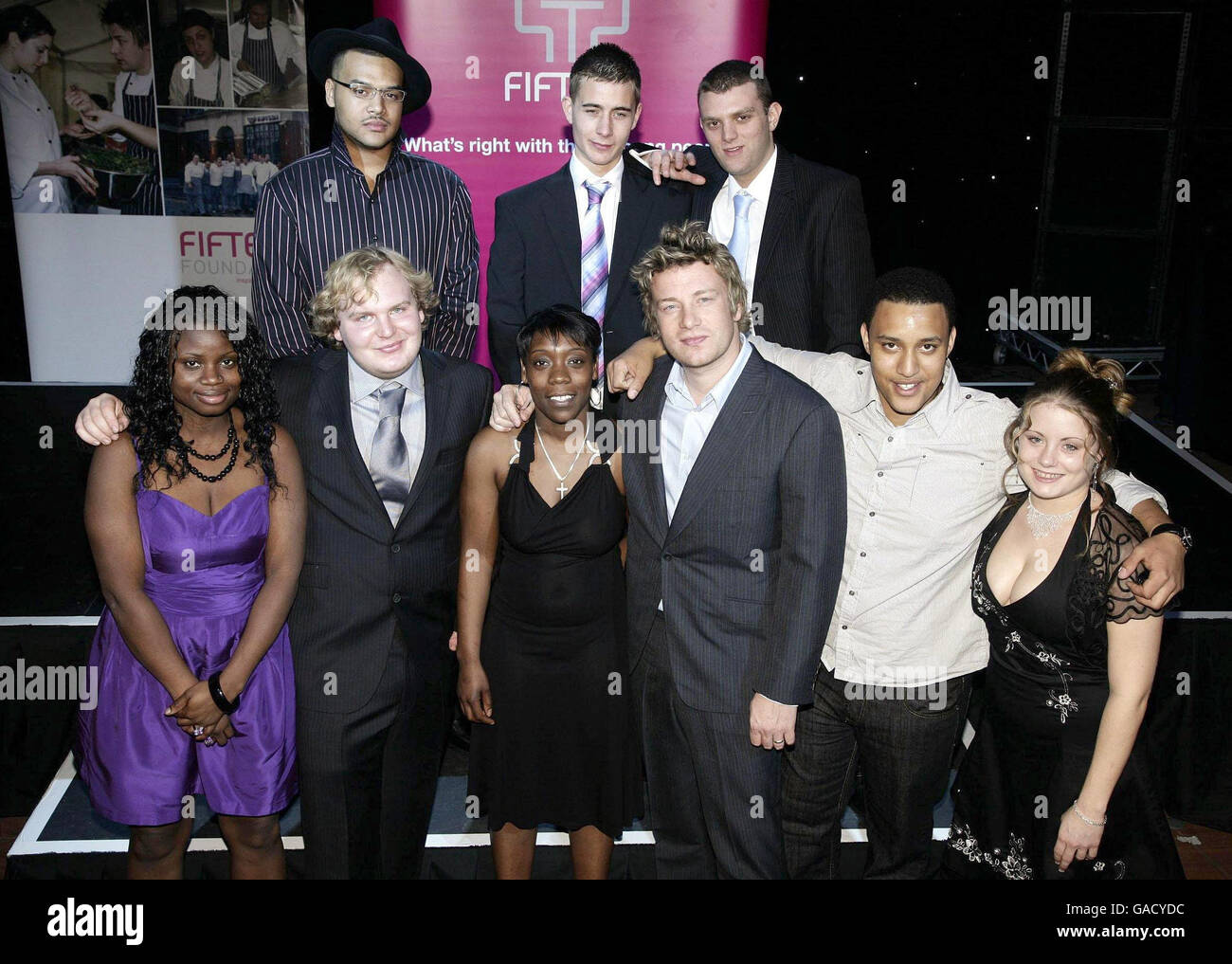 Founder of 'Fifteen' Jamie Oliver (front row, third right) with the 2007 graduates of his pioneering apprenticeship scheme (back row, left-right) Levi Malcolm, Christian Gottschalk and David Slim, (front row, left-right) Feyi Asuni, Michael Kress, Davina Thompson, Jamie Oliver, Gavin Gordon and Lucy Jenkins celebrate the 5th birthday of Jamie's 'Fifteen' restaurant at SeOne in south London. Stock Photo