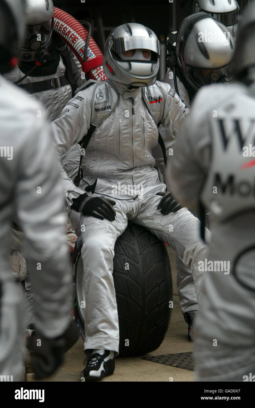Formula One Motoracing - British Grand Prix - Race. A McLaren mechanic sits dejected in the pitlane as his team have a disasterous race Stock Photo
