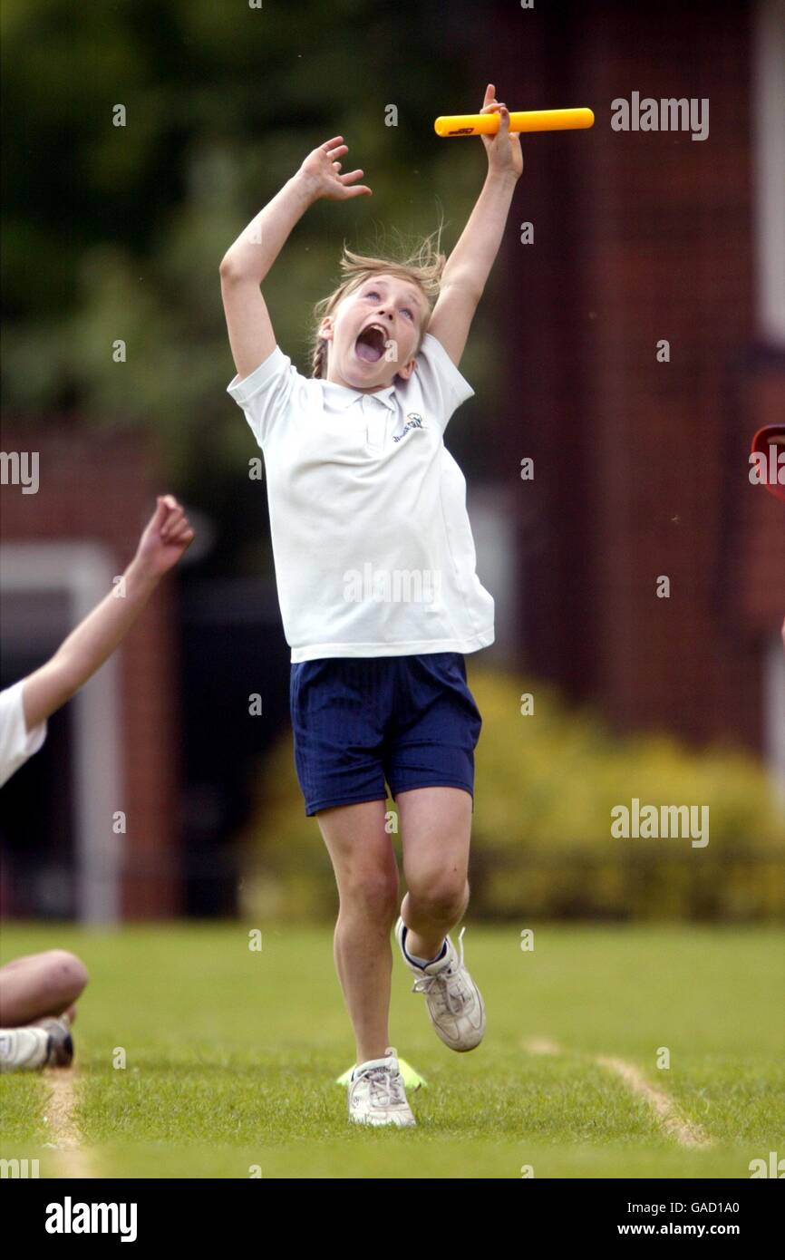 Athletics - The Jesse Gray School Sports Day. A girl celebrates her teams victory in the relay Stock Photo