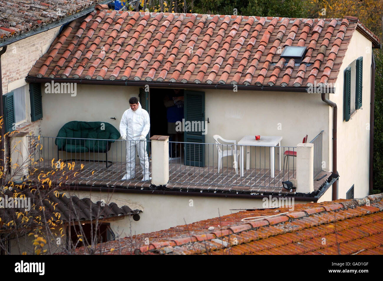 Police on the balcony of the flat where Meredith Kercher was found