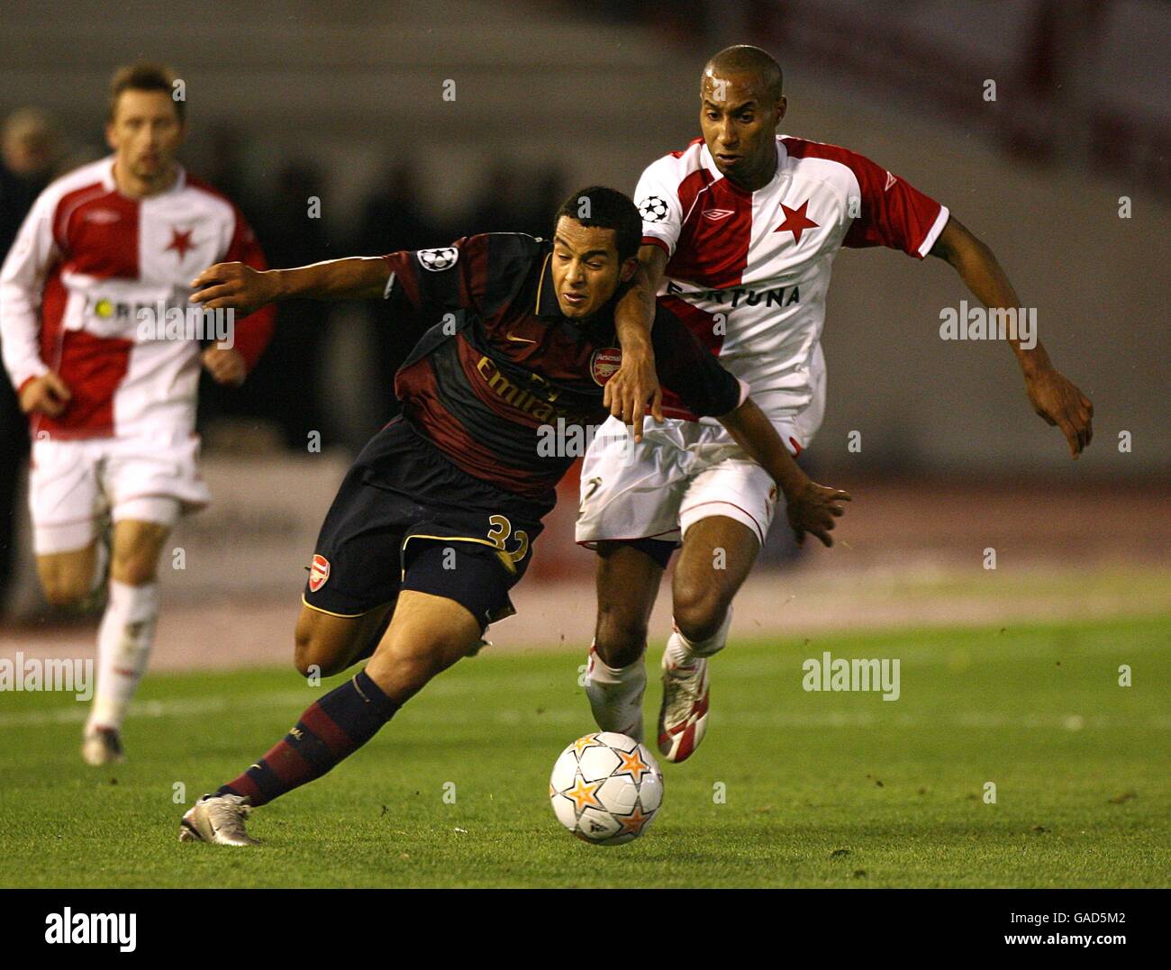 Arsenal's Theo Walcott is tackled by Slavia Prague's Mickael Tavaresk Stock Photo