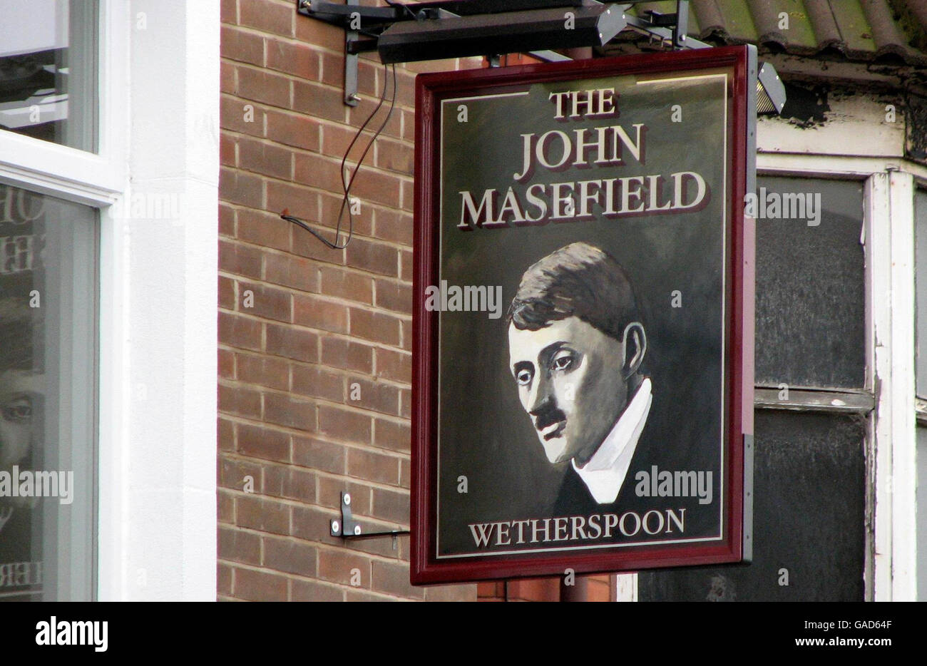 A general view of the John Masefield pub in Rock Ferry, Wirral, Merseyside, which has drawn complaints because of Masefield's striking similarity to Adolf Hitler in a sign on the premises. Stock Photo