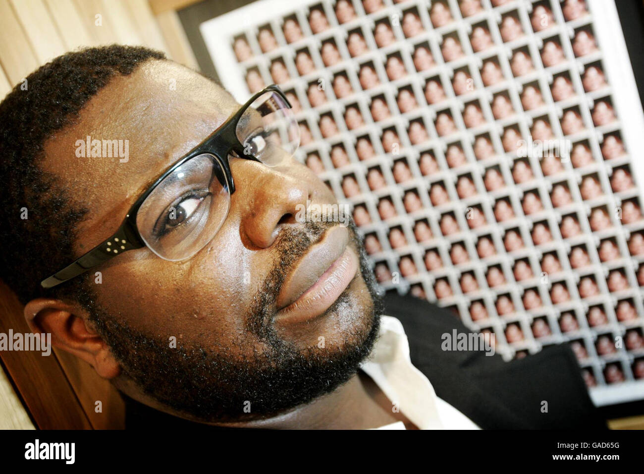 Artist Steve McQueen with his latest work 'Queen and Country' at the Imperial War Museum, London, which depicts British Soldiers who lost their lives in Iraq. Stock Photo