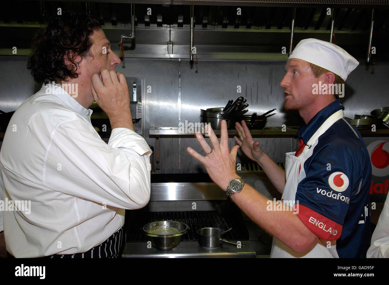 Chef Marco Pierre White and Paul Collingwood in the kitchen at Marco Restaurant, Stamford Bridge, London. Stock Photo