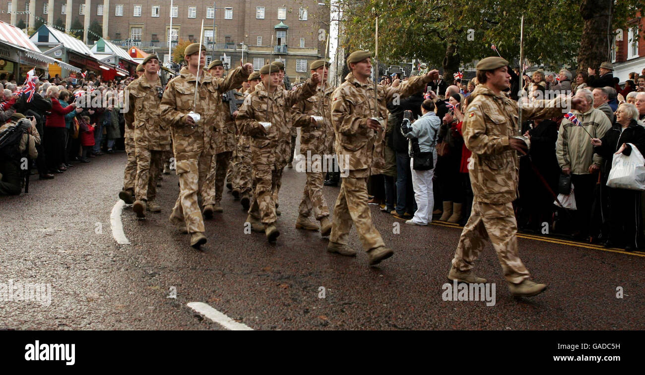 Members of the public gather to soldiers of the Royal Anglian