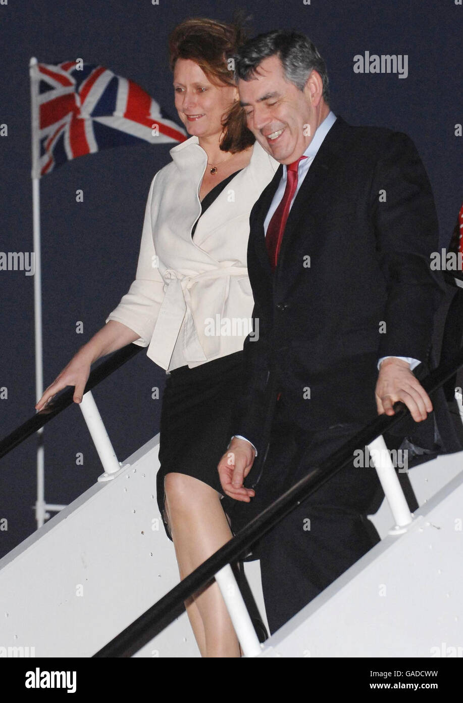 Prime Minister Gordon Brown and his wife Sarah arrive back at Heathrow Airport today after attending the Commonweath Heads of Government Meeting in Uganda. Stock Photo