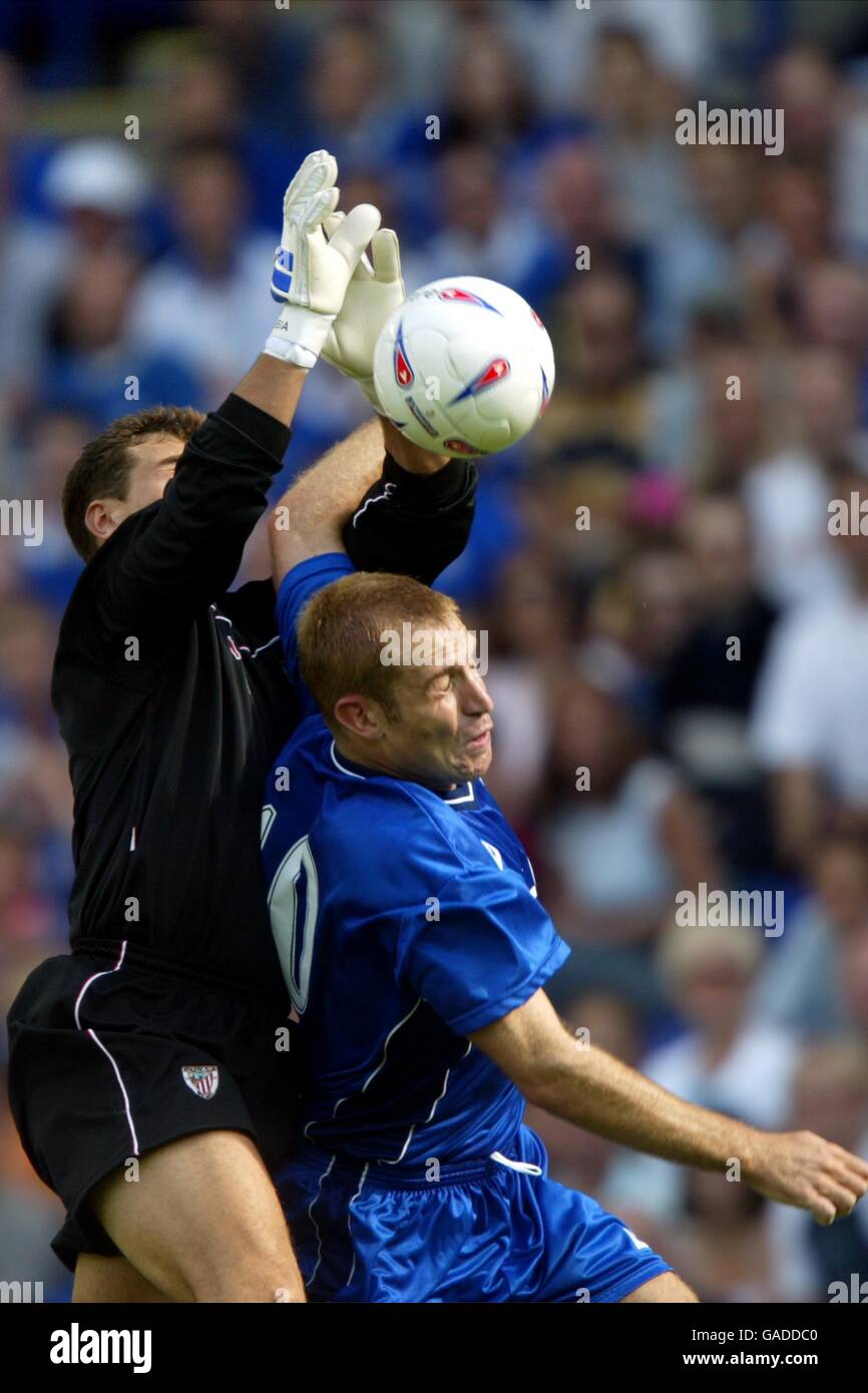 Athletic Bilbao goalkeeper Aranzubia and Leicester City's James Scowcroft battle for the ball Stock Photo