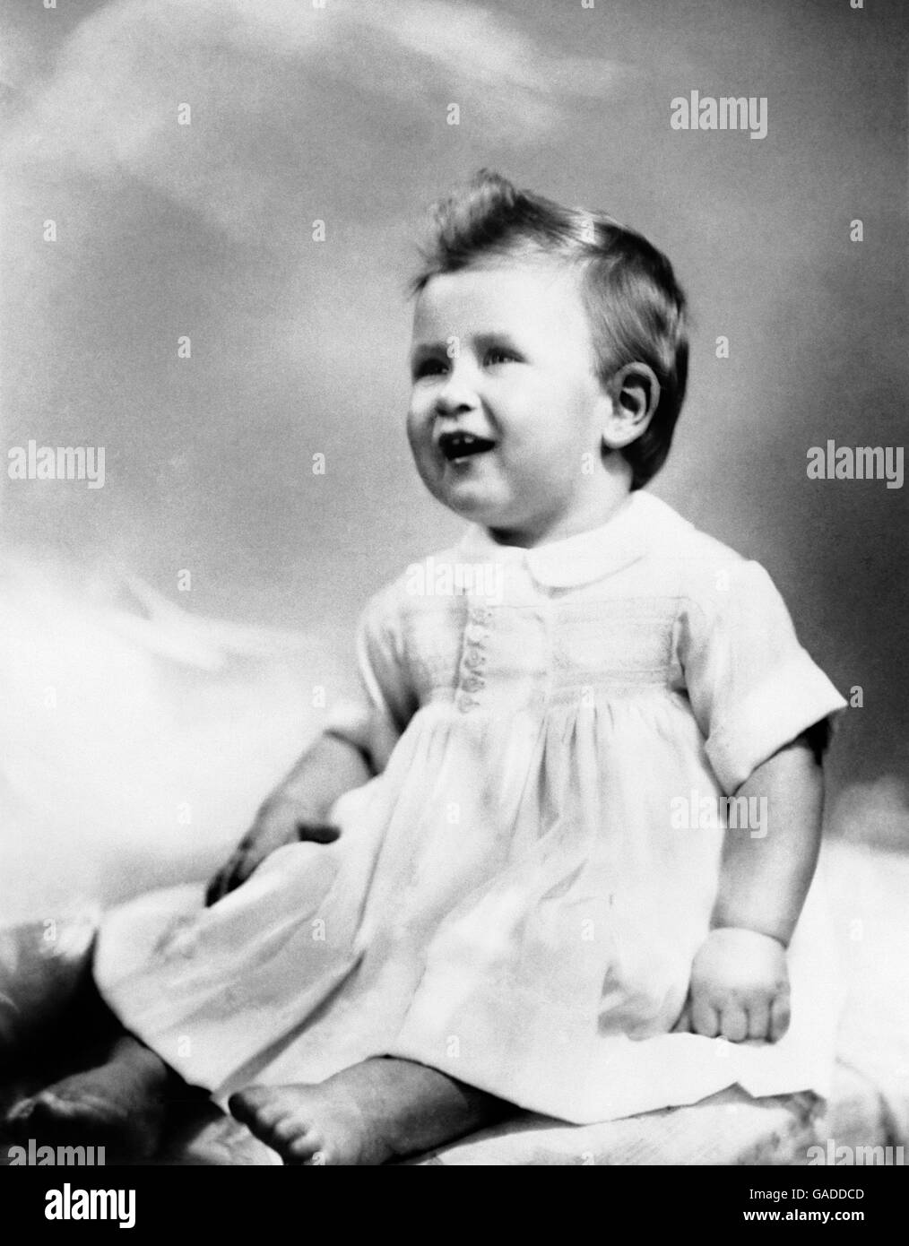 Prince Charles son of Princess Elizabeth and the Duke of Edinburgh, was taken for his 1st birthday. At 11 1/2 months the baby prince weighed 24 1/2 lbs and had 6 teeth and could walk a few steps holding onto his play pen. Stock Photo