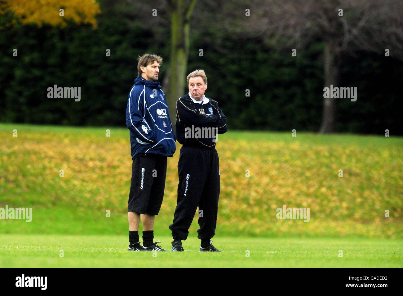 Portsmouth manager Harry Redknapp stands with assistant manager Tony Adams at a training session this morning, in Eastleigh. Stock Photo