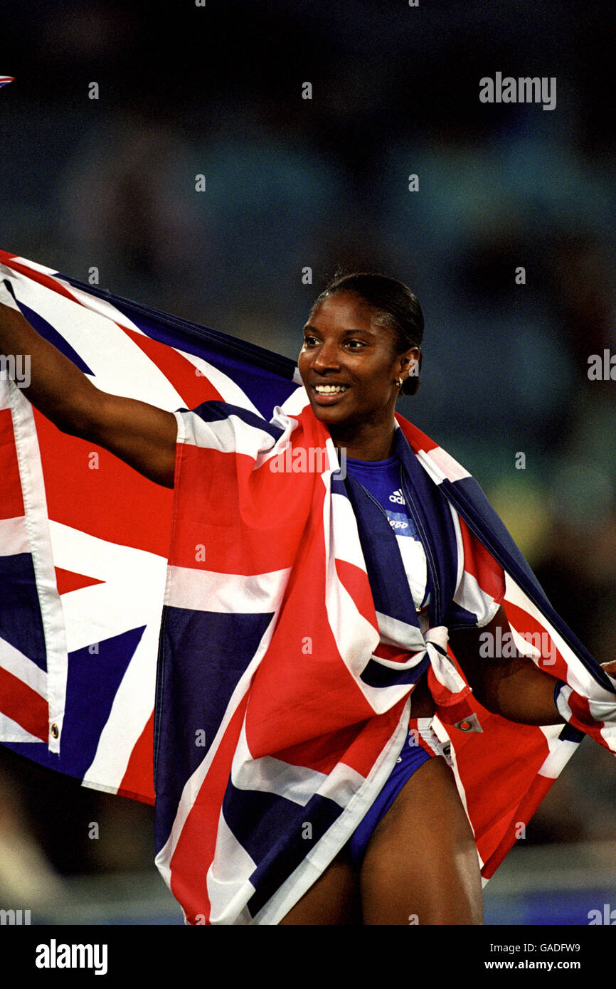 Great britains denise lewis celebrates winning gold medal in heptathlon