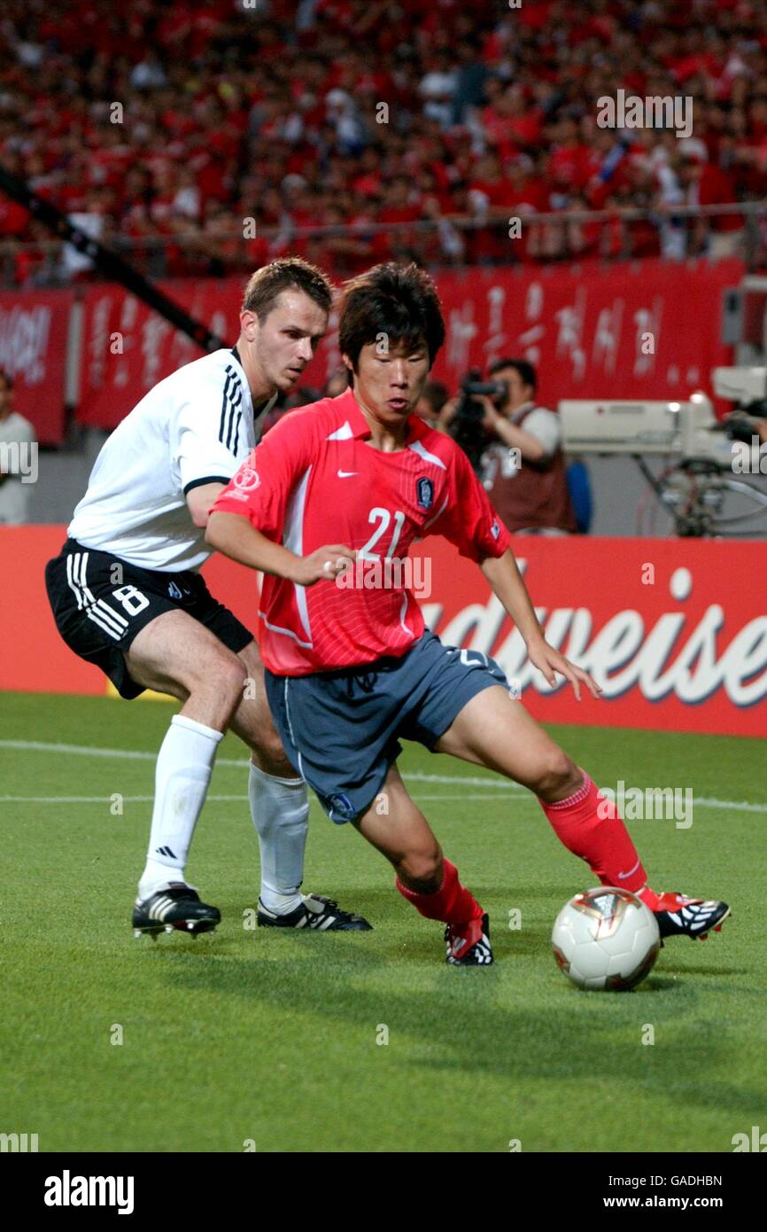 Soccer -FIFA World Cup 2002 - Semi Final - Germany v Repubilic of Korea. Korea's Sung Ji Park (r) is pursued by Germany Dietmar Hamann (l) Stock Photo