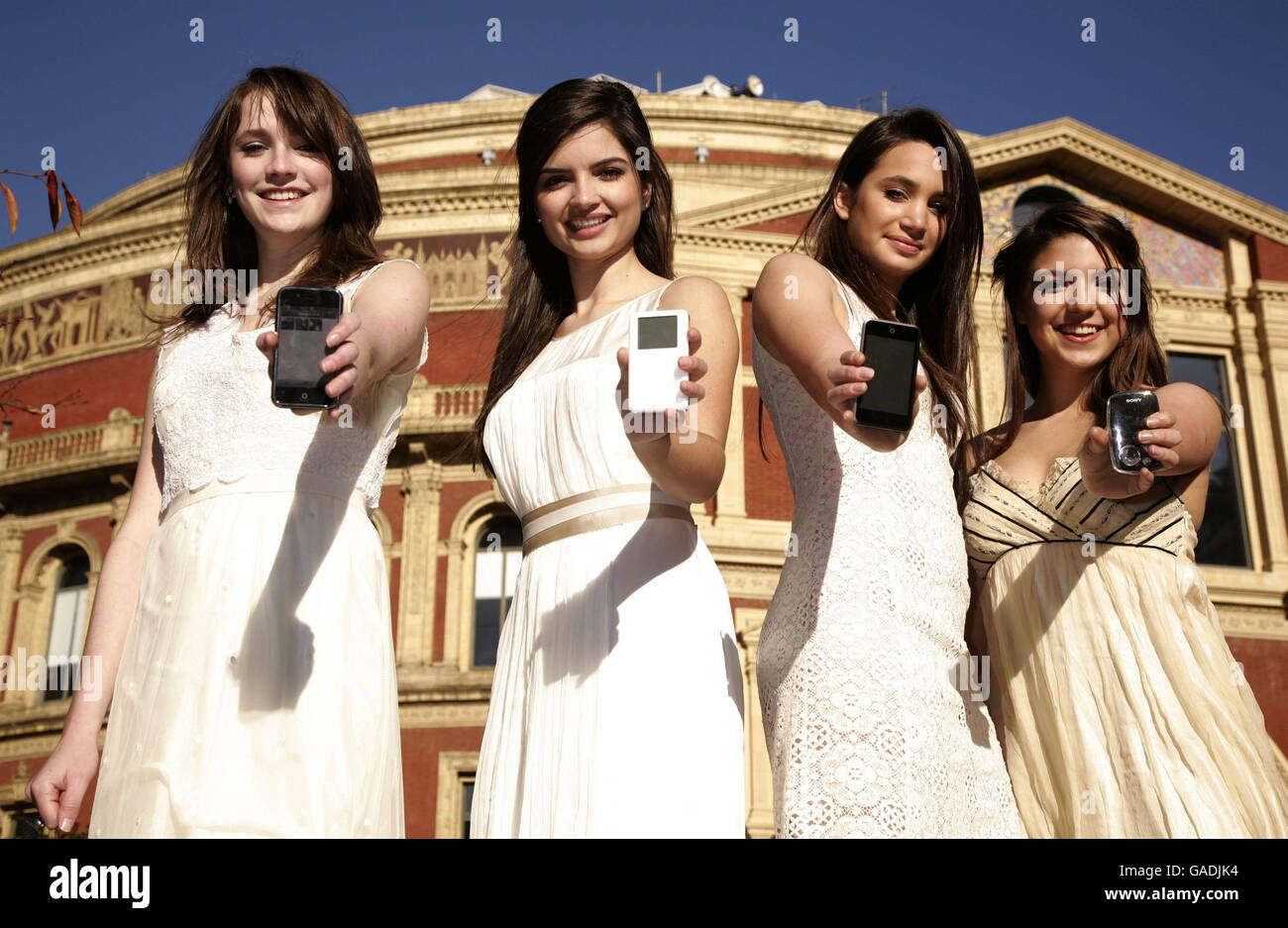 Classical girl group All Angels (left-right) Laura Wright, Charlotte Ritchie, Daisy Chute & Melanie Nakhla highlighting Universal Music Group's decision to remove copy protection across it's entire Classics & Jazz catalogue in a download trial, at Universal's head office in Kensington, west London. Stock Photo