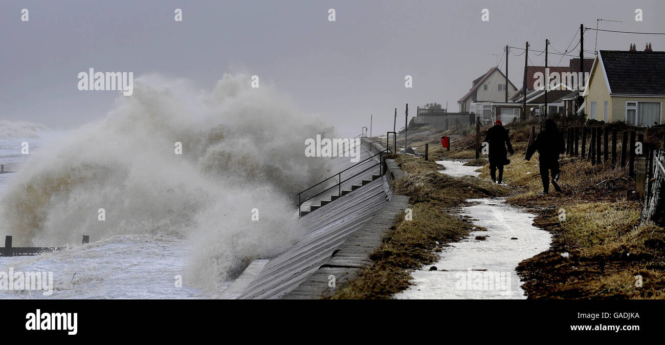 Huge waves pound the sea wall at Walcott near Great Yarmouth. Stock Photo