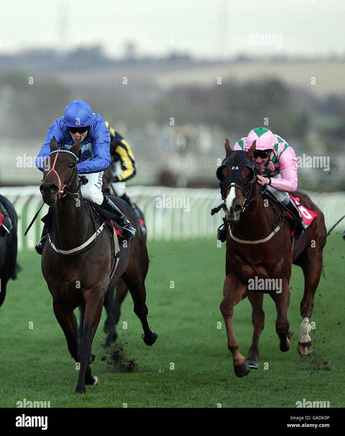 Crocodile Bay ridden by Jamie Spencer (left) and Spinning ridden by Seb Sanders both fail to win the Redman Fisher Handicap at Musselburgh Racecourse. Stock Photo