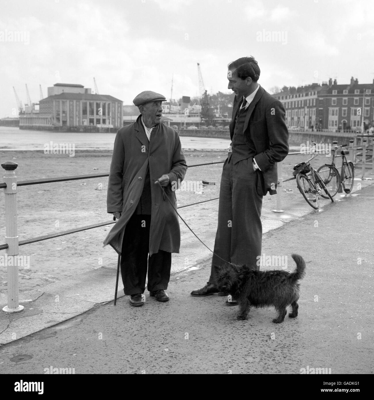 Guy Barnett, 33 year old Labour candidate in the South Dorset Parliamentary by-election, canvassing a constituent on the windswept promenade at Weymouth. Stock Photo