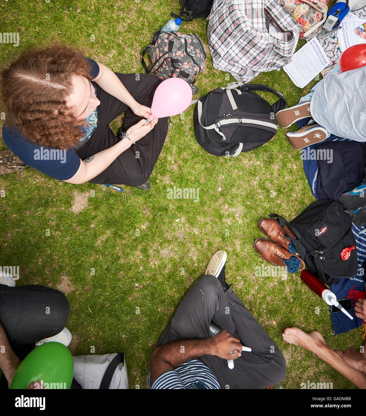 Protesters stage a mass inhalation of nitrous oxide in Parliament Square in protest against the banning of the legal high Stock Photo