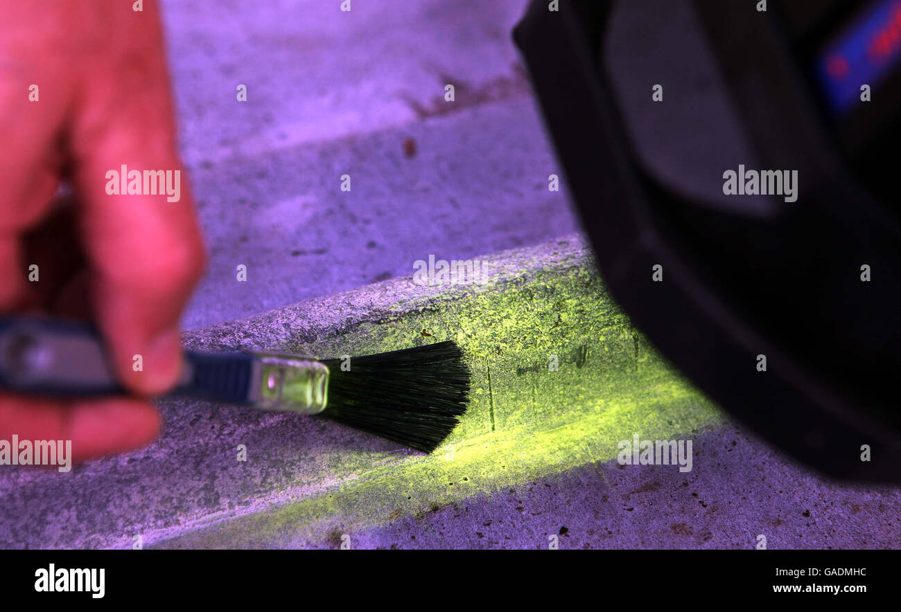 Smartwater glows in infrared light on the roof of St. Andrew's Church, Shifnal, Shropshire where the lead has been stolen for the third time in four weeks. Stock Photo