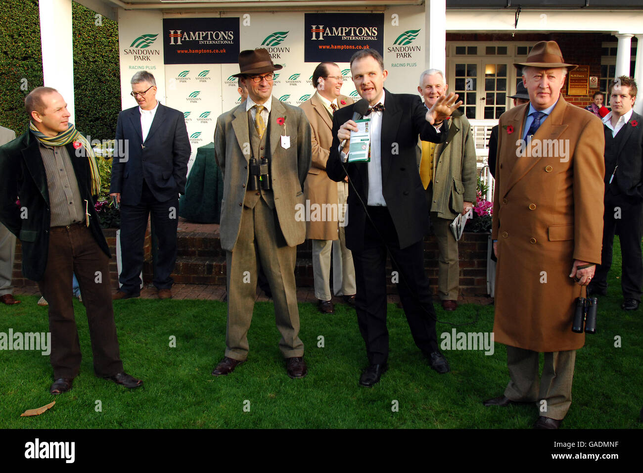 Racegoers take part in competitions, as part of Gentlemen's Day at Sandown Stock Photo