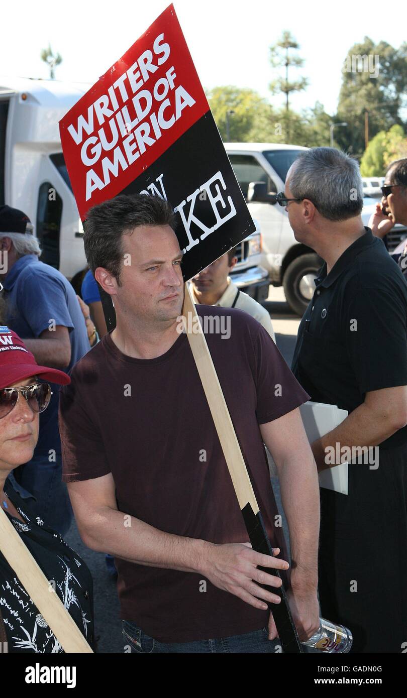 Matthew Perry shows his support for writers, who are currently on strike seeking a better pay deal, as they picket at the Universal City Studios in Los Angeles. Stock Photo